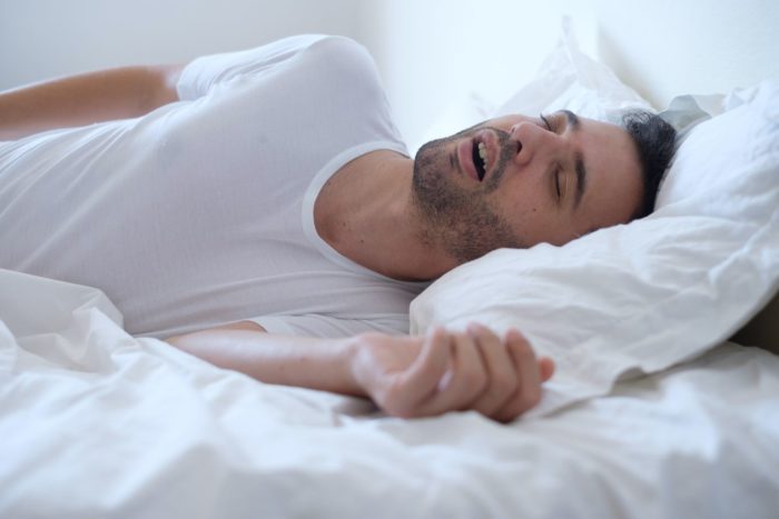Man sleeping with mouth open from sleep apnea dentist in Nixa Missouri